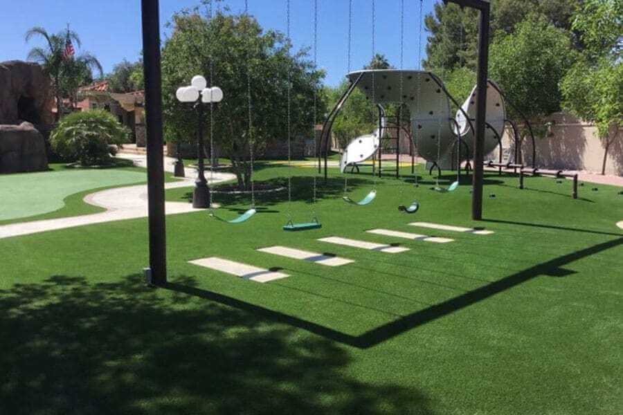 Artificial playground grass with swingset