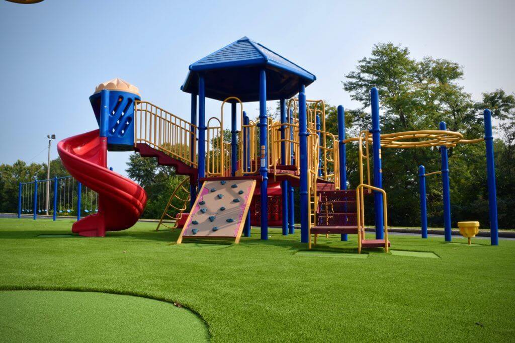 Artificial playground grass with jungle gym