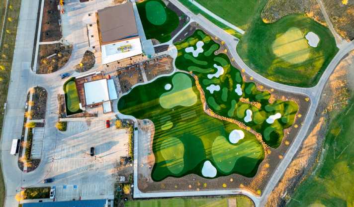 drone shot of artificial golf course with multiple putting options