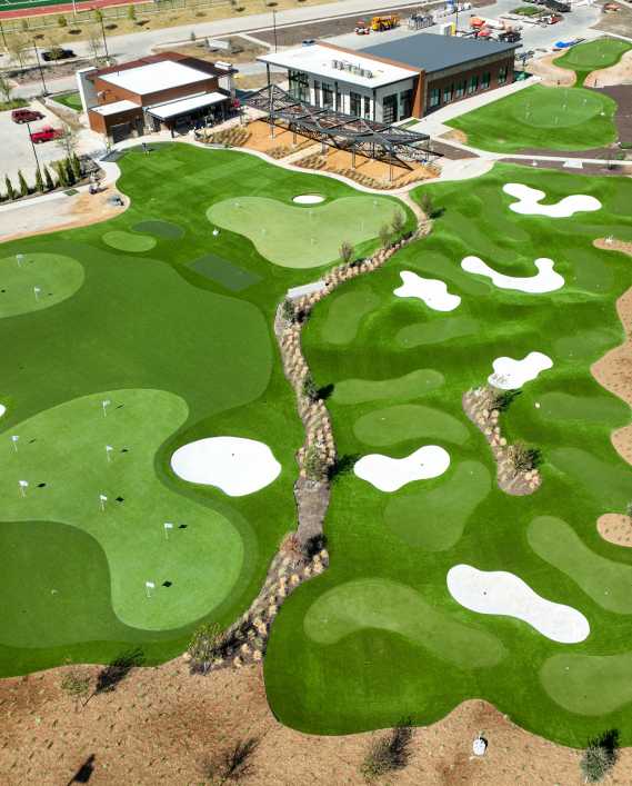 default drone shot of a commercial artificial grass mini golf course